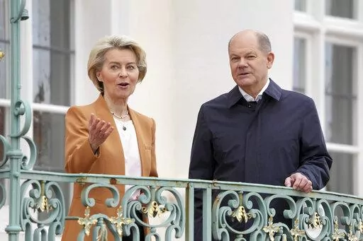 German Chancellor Olaf Scholz, right, welcomes European Commission President Ursula von der Leyen, left, for a meeting as part of a two-day closed meeting of the German government at Meseberg palace in Gransee near Berlin, Germany, Sunday, March 5, 2023. (AP Photo/Michael Sohn)