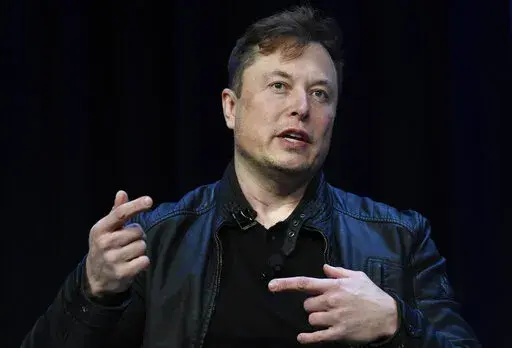 Tesla and SpaceX Chief Executive Officer Elon Musk speaks at the SATELLITE Conference and Exhibition in Washington, on March 9, 2020. Tesla shares tumbled more than 7% in early trading on Friday, June 3, 2022, on a report that Musk is considering laying off 10% of the electric automakers’ workers.  (AP Photo/Susan Walsh, File)