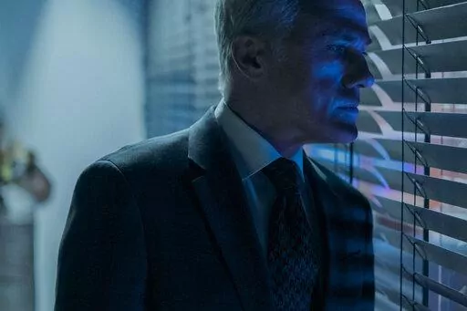This image released by Amazon shows Christoph Waltz in a scene from "The Consultant." (Amazon via AP)