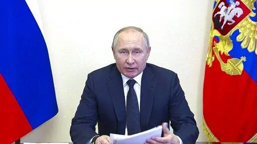 In this photo taken from video released by the Russian Presidential Press Service, Russian President Vladimir Putin speaks via videoconference at the Novo-Ogaryovo residence outside Moscow, Russia, Wednesday, March 16, 2022. (Russian Presidential Press Service via AP, File)
