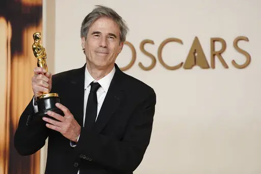 Walter Salles, winner of the award for "I'm Still Here" from Brazil, for best international feature film, poses in the press room at the Oscars on Sunday, March 2, 2025, at the Dolby Theatre in Los Angeles. (Photo by Jordan Strauss/Invision/AP)