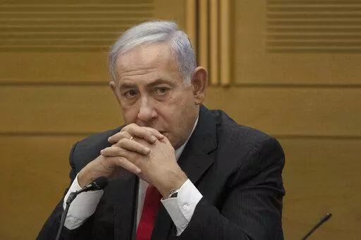Former Israeli Prime Minister Benjamin Netanyahu speaks to right-wing opposition party members, at the Knesset, Israel's parliament, in Jerusalem on June 14, 2021. Former Israeli Prime Minister Benjamin Netanyahu is negotiating a plea deal in his corruption case. A person involved in the negotiations said Sunday, Jan. 16, 2021, that the agreement is likely to be announced in the coming days and could usher Netanyahu off the Israeli political stage for years. (AP Photo/Maya Alleruzzo, File)