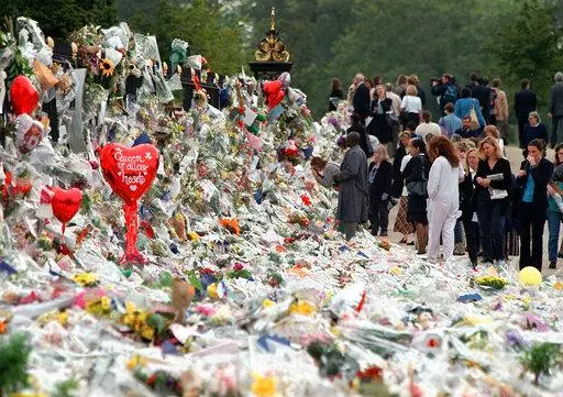 Mourners file past the tributes left in memory of Diana Princess of Wales at Kensington Palace in London, Friday, Sept. 5, 1997. It was a warm Saturday evening and journalists had gathered at a Paris restaurant to enjoy the last weekend of summer. At sometime past midnight, phones around the table began to ring all at once. News desks were contacting reporters and photographers to alert them that Princess Diana’s car had crashed in the Pont de l’Alma tunnel in Paris. That's how the news unfo