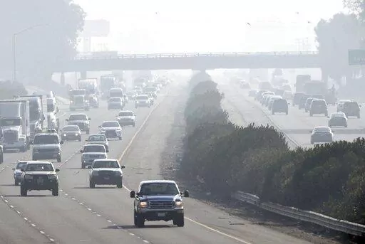 Traffic moves along along 99 south in Fresno, Calif., Dec. 28, 2017. Fresno displaced Fairbanks, Alaska as the metropolitan area with the worst short-term particle pollution, a 2022 report by the American Lung Association found, while Bakersfield, Calif., continued in the most-polluted slot for year-round particle pollution for the third year in a row. (John Walker/The Fresno Bee via AP)
