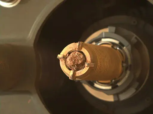 This photo provided by NASA shows a rock collected by the Perseverance rover on Mars. NASA is launching two more mini helicopters to Mars in its effort to recover Martian rocks and soil samples and bring them to Earth.
Under the plan announced Wednesday, July 27, 2022,   NASA’s Perseverance rover will do double duty and transport samples to the rocket that will launch them off Mars a decade from now.
Perseverance already has gathered 11 samples, with about 30 more to go. The most recent samp