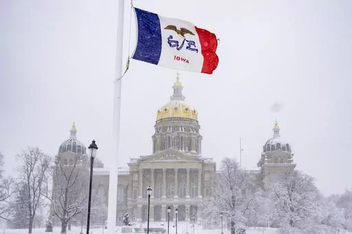 Snow falls at the Iowa State Capitol Building in Des Moines, Iowa, Jan. 9, 2024, as a winter snow storm hits the state. As frigid temperatures scour the Midwest, Monday, Jan. 15, marks the official start to the Republican presidential nominating contest with the Iowa caucuses. Iowa has been relatively quiet this cycle compared to years past, because former President Donald Trump is dominating the contest. That makes one of the things to watch Monday who comes in second. (AP Photo/Andrew Harnik, 