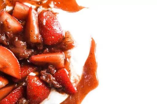 This image released by Milk Street shows a recipe for Citrus and Spice Strawberry Compote. (Milk Street via AP)