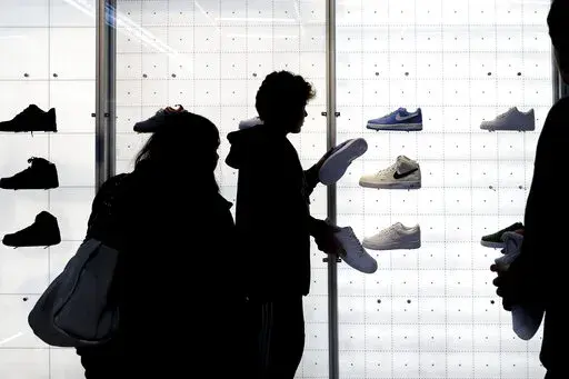 People shop for shoes in a Nike store on , Nov. 25, 2022, in New York. “Buy now, pay later” services like Affirm, Afterpay and Klarna can sometimes provide a cheaper, more accessible version of credit. These services essentially provide customers an alternative way to pay for purchases over time without going into credit card debt or taking out a traditional personal loan. Travel purchases, such as airfare and vacation rentals, are the fastest-growing segment for buy now, pay later services.