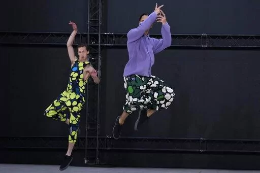 Models wear creations as part of Issey Miyake Homme Plisse men's Spring Summer 2023 collection presented in Paris, France, Thursday, June 23, 2022. (AP Photo/Francois Mori)