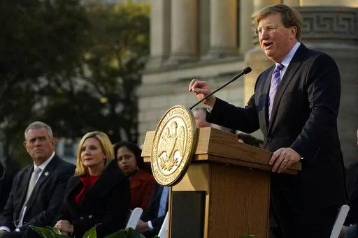 Mississippi Gov. Tate Reeves says during his State of the State speech on Jan. 25, 2022, at the state Capitol that he supports a proposal to phase out the state income tax. House Speaker Philip Gunn, right, and the governor’s wife, Elee Reeves, listen to the speech. (AP Photo/Rogelio V. Solis, File)