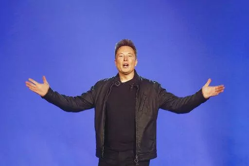 Tesla CEO Elon Musk introduces the Cybertruck at Tesla's design studio Thursday, Nov. 21, 2019, in Hawthorne, Calif. Musk has laid out some bold, if still vague, plans for transforming Twitter into a place of “maximum fun!” once he buys the social media platform for $44 billion and takes it private. (AP Photo/Ringo H.W. Chiu, File)