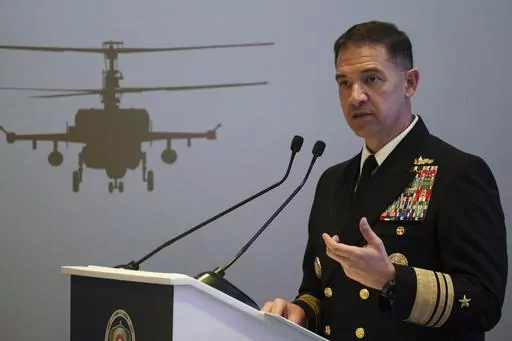 U.S. Navy Vice Adm. Brad Cooper, who heads the Navy's Bahrain-based 5th Fleet, speaks at an event at the International Defense Exhibition and Conference in Abu Dhabi, United Arab Emirates, Feb. 21, 2023. The top commander of U.S. naval forces in the Middle East says Yemen’s Houthi rebels are showing no signs of ending their “reckless” attacks on commercial ships in the Red Sea. But Vice Adm. Brad Cooper said in an Associated Press interview on Saturday that more nations are joining the int