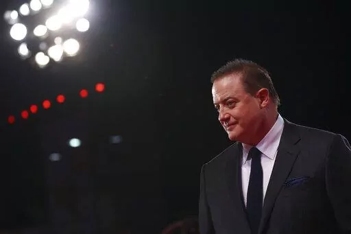 Brendan Fraser poses for photographers upon arrival at the premiere of the film 'The Whale' during the 79th edition of the Venice Film Festival in Venice, Italy, Sunday, Sept. 4, 2022. (Photo by Vianney Le Caer/Invision/AP)