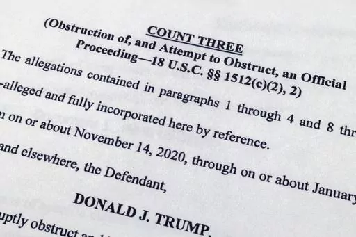 The indictment against former President Donald Trump charging him by the Justice Department for his efforts to overturn the results of the 2020 presidential election is photographed Tuesday, Aug. 1, 2023, in Washington. (AP Photo/Jon Elswick)