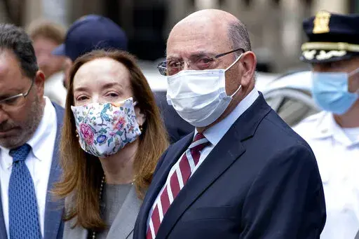 FILE — The Trump Organization's Chief Financial Officer Allen Weisselberg, awaits a car after leaving a courtroom appearance in New York, Sept. 20, 2021. Lawyers for Donald Trump's longtime finance chief are asking a judge on Tuesday, Feb. 22, 2022, to throw out tax fraud charges against him, arguing New York prosecutors targeted him as punishment because he wouldn't flip on the former president. (AP Photo/Craig Ruttle, File)