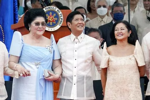 President Ferdinand Marcos Jr. stands with his mother Imelda Marcos, left, and his wife Maria Louise Marcos, right, during the inauguration ceremony at National Museum on Thursday, June 30, 2022 in Manila, Philippines. Marcos was sworn in as the country's 17th president. (AP Photo/Aaron Favila)