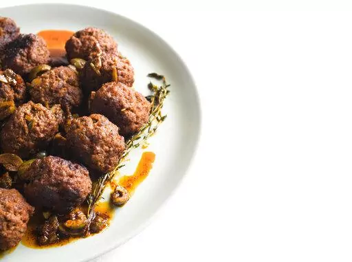 This image released by Milk Street shows a recipe for Spanish Meatballs. (Milk Street via AP)