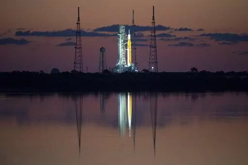 In this photo released by NASA, the Space Launch System (SLS) rocket with the Orion spacecraft aboard is seen at sunrise atop a mobile launcher at Launch Complex 39B at NASA's Kennedy Space Center in Cape Canaveral, Fla., Monday, April 4, 2022, in preparation for the Artemis I wet dress rehearsal test. Launch managers tried twice _ once Sunday and again Monday _ to load nearly 1 million gallons of fuel into the 322-foot (98-meter) rocket. Problems with fans at the launch pad thwarted the first e