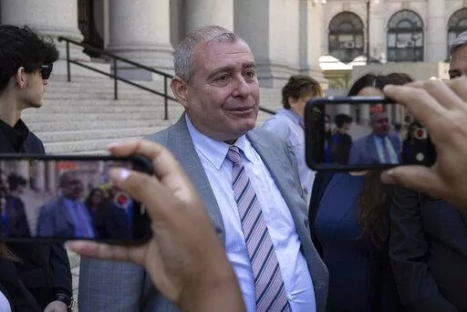 Lev Parnas, center, speaks to the media outside the federal courthouse in New York, Wednesday, June 29, 2022.  Parnas, an associate of Rudy Giuliani who was a figure in President Donald Trump's first impeachment investigation, was sentenced Wednesday to a year and eight months in prison for fraud and campaign finance crimes.  (AP Photo/Yuki Iwamura)