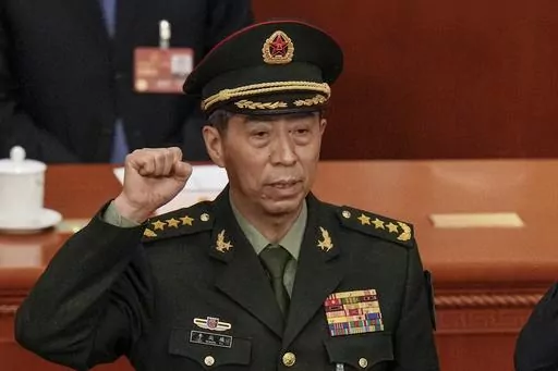 Newly elected Chinese Defense Minister Gen. Li Shangfu takes his oath during a session of China's National People's Congress (NPC) at the Great Hall of the People in Beijing on March 12, 2023. China has replaced Defense Minister Gen. Li, who has been out of public view for almost two months with little explanation, state media reported Tuesday, Oct. 24. (AP Photo/Andy Wong, File)
