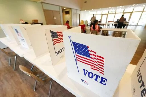 Empty poll kiosks await voters at the Mississippi Second Congressional District Primary election precinct, Tuesday, June 7, 2022, in Jackson, Miss. A light turnout of voters is expected statewide during the midterm primary election. (AP Photo/Rogelio V. Solis)