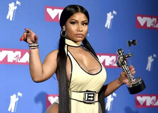 Nicki Minaj poses in the press room with her award for best hip-hop video for "Chun-Li" at the MTV Video Music Awards in New York on Aug. 20, 2018. Minaj will receive the Video Vanguard Award at the MTV Awards later this month. Minaj, who has won five MTV trophies for such hits as “Anaconda,” “Chun-Li” and “Hot Girl Summer,” will get the award and perform at the ceremony on Aug. 28 at the Prudential Center in Newark, N.J. (Photo by Evan Agostini/Invision/AP, File)