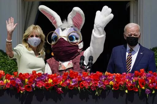 President Joe Biden appears with first lady Jill Biden and the Easter Bunny on the Blue Room balcony at the White House April 5, 2021, in Washington. The White House Easter Egg Roll is returning on April 18, 2022, after a 2-year, COVID-induced hiatus. The Biden's will welcome some 30,000 kids and their adult chaperones for the egg roll, an egg hunt and other activities. (AP Photo/Evan Vucci, File)