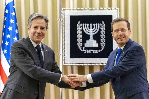 U.S. Secretary of State Antony Blinken, left, and Israel's President Isaac Herzog pose for a photo as they meet at the Presidency, Sunday, March 27, 2022, in Jerusalem. (AP Photo/Jacquelyn Martin, Pool)