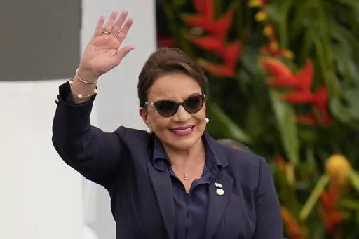 Honduras' President Xiomara Castro waves during the swearing-in ceremony for Colombia's President Gustavo Petro in Bogota, Colombia, Sunday, Aug. 7, 2022. Castro announced on Tuesday, March 14, 2023, that Honduras under her administration is opening diplomatic relations with the People´s Republic of China. (AP Photo/Fernando Vergara, File)
