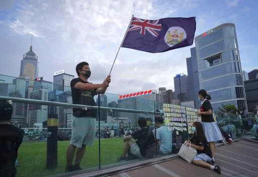 A protester waves Hong Kong British colony flag during continuing pro-democracy rallies in Tamar Park, Hong Kong, on Sept. 3, 2019. When the British handed its colony Hong Kong to Beijing in 1997, it was promised 50 years of self-government and freedoms of assembly, speech and press that are not allowed Chinese on the Communist-ruled mainland. As the city of 7.4 million people marks 25 years under Beijing's rule on Friday, those promises are wearing thin. Hong Kong's honeymoon period, when it ca
