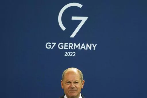 German Chancellor Olaf Scholz attends the presentation of a special stamp of the German mail service Deutsche Post for the upcoming G7 summit, at the chancellery in Berlin, Germany, Wednesday, June 15, 2022. Three back-to-back summits over the next week will test Western resolve to support Ukraine and the extent of international unity as rising geopolitical tensions and economic pain cast an increasingly long shadow. (AP Photo/Markus Schreiber, File)