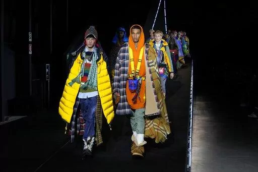 Models wear creations for the DSquared2 fall winter 22/23 collection, in Milan, Italy, Friday, Jan. 14, 2022. (AP Photo/Luca Bruno)