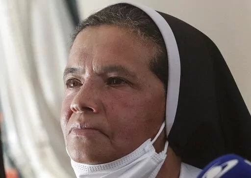 FILE — Colombian nun Gloria Cecilia Narvaez, who was held captive for nearly five years by al-Qaida-linked militants, listens to a question during a press conference in Bogota, Colombia, in this Friday, Nov. 19, 2021 file photo. Pope Francis authorized spending up to 1 million euro to free Narvaez, Cardinal Angelo Becciu testified at the Vatican's big financial fraud trial Thursday, May 5, 2022, revealing previously top secret negotiations that Francis authorized to hire a British security and