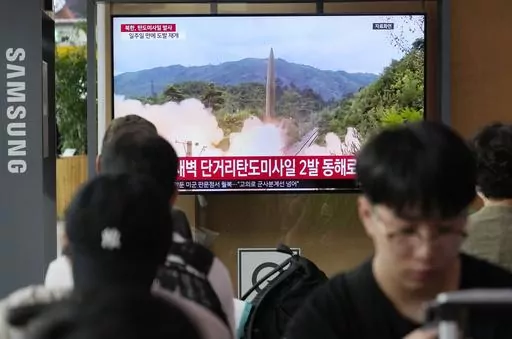 A TV screen shows a file image of North Korea's missile launch during a news program at the Seoul Railway Station in Seoul, South Korea, Wednesday, July 19, 2023. North Korea fired two short-range ballistic missiles into its eastern sea early Wednesday in what appeared to be a statement of defiance as the United States deploys a nuclear-armed submarine to South Korea for the first time in decades. (AP Photo/Ahn Young-joon)