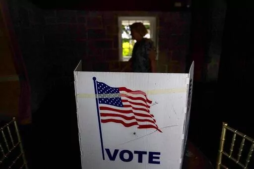 A person waits in line to vote in the Georgia's primary election on May 24, 2022, in Atlanta. A new poll shows 71% of voters think the future of the country is at stake when they vote in November's midterm elections. That's according to a new poll from The Associated Press-NORC Center for Public Affairs Research. (AP Photo/Brynn Anderson, File)