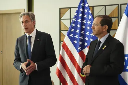 U.S. Secretary of State Antony Blinken, left, and Israel's President Isaac Herzog speak to the media in Tel Aviv, Tuesday, Oct. 22, 2024. (Nathan Howard/Pool via AP)