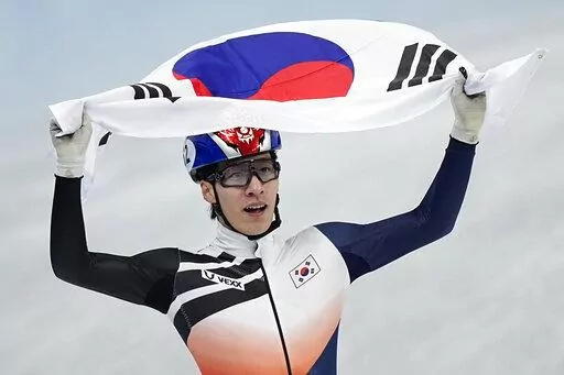 Hwang Dae-heon of South Korea celebrates after winning his men's 1500-meters final during the short track speedskating competition at the 2022 Winter Olympics, Wednesday, Feb. 9, 2022, in Beijing. South Korea was angered by the disqualifications of two of its short-track speedskaters, including Hwang, in the semifinals of the 1,000 meters speedskating at the Beijing Games this week. A protest was filed and South Koreans online called for the team to withdraw in protest. Instead, they stayed, and