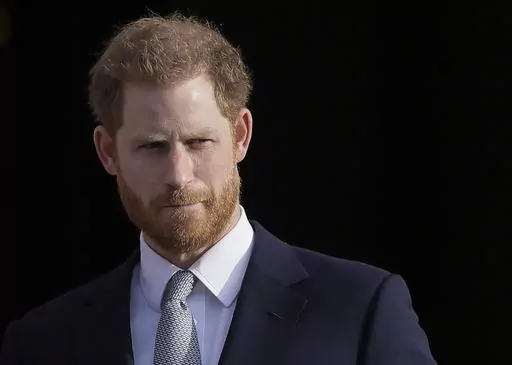 Britain's Prince Harry arrives in the gardens of Buckingham Palace in London, Jan. 16, 2020. Prince Harry has reached an out-of-court settlement with a tabloid newspaper publisher that invaded his privacy with phone hacking and other illegal snooping. Attorney David Sherborne said Friday that Mirror Group Newspapers had agreed to pay Harry’ “substantial” costs and damages and would make an interim payment of 400,000 pounds or $505,000. (AP Photo/Kirsty Wigglesworth, File)