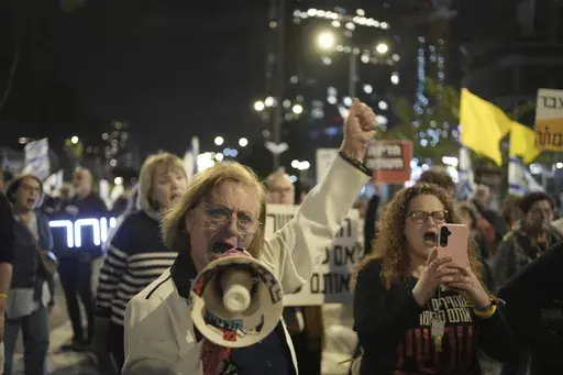 People take part in a protest demanding the immediate release of hostages held by Hamas in the Gaza Strip, in Tel Aviv, Israel, Saturday, March 29, 2025. (AP Photo/Maya Alleruzzo)