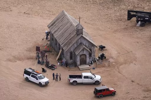 This aerial photo shows the movie set of "Rust," at Bonanza Creek Ranch, Oct. 23, 2021, in Santa Fe, N.M. Prosecutors are accusing the weapons supervisor on the film set where Alec Baldwin shot and killed a cinematographer of drinking and smoking marijuana in the evenings during the filming of “Rust,” saying she was likely hung over when she loaded a live bullet into the revolver that was used by the actor. (AP Photo/Jae C. Hong, File)