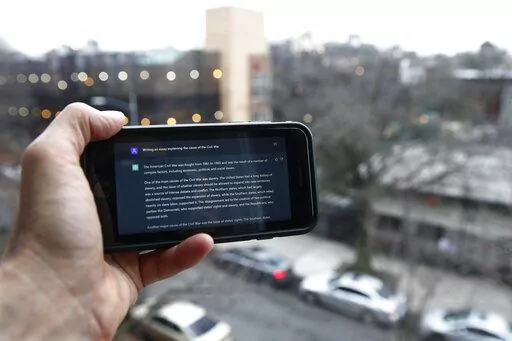 A ChatGPT prompt is shown on a device near a public school in Brooklyn, New York, Thursday, Jan. 5, 2023. New York City school officials started blocking this week the impressive but controversial writing tool that can generate paragraphs of human-like text. (AP Photo/Peter Morgan)