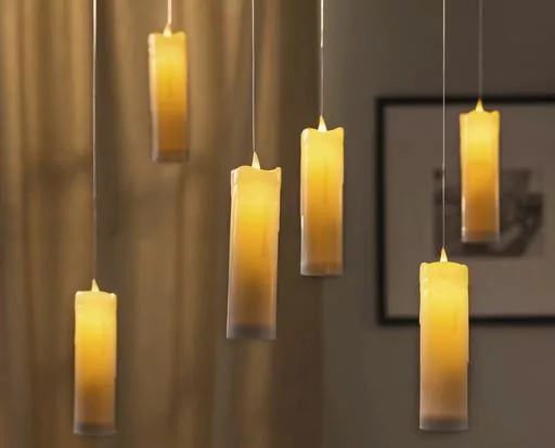 This photo provided by Balsam Hill shows their battery-operated floating candle set. Displayed indoors or out, it creates a spooky aura that might even evoke Harry Potter for some. (Balsam Hill via AP)