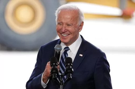 President Joe Biden smiles as he speaks after touring the Taiwan Semiconductor Manufacturing Company facility under construction in Phoenix, on Dec. 6, 2022. Biden is facing consistent but critical assessments of his leadership and the national economy as his second year in the White House comes to a close. A new poll from The Associated Press-NORC Center for Public Affairs Research finds 43% of U.S. adults say they approve of the way Biden is handling his job as president, while 55% disapprove.