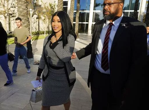 Cardi B exits federal court as proceedings continue in a $5 million copyright infringement lawsuit against her in federal court, Wednesday, Oct. 19, 2022, in Santa Ana, Calif. Kevin Michael Brophy is suing the Grammy-winning musician for allegedly misusing his likeness for her sexually suggestive mixtape cover art in 2016. (AP Photo/Chris Pizzello)