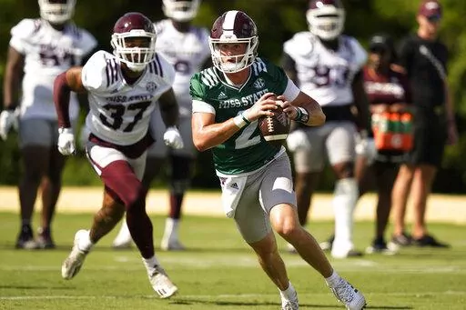 Mississippi State quarterback Will Rogers (2) scrambles with the ball during an NCAA college football practice, Friday, Aug. 5, 2022, in Starkville, Miss. (AP Photo/Rogelio V. Solis)
