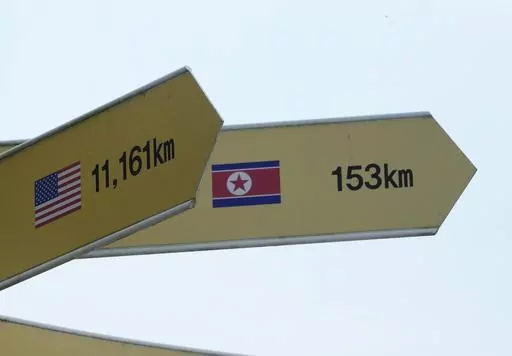 Destination signs to North Korea's capital Pyongyang and the United States are seen at the Imjingak Pavilion in Paju, South Korea, near the border with North Korea, Thursday, July 20, 2023. North Korea wasn't responding Thursday to U.S. attempts to discuss the American soldier who bolted across the heavily armed border and whose prospects for a quick release are unclear at a time of high military tensions and inactive communication channels. (AP Photo/Ahn Young-joon)