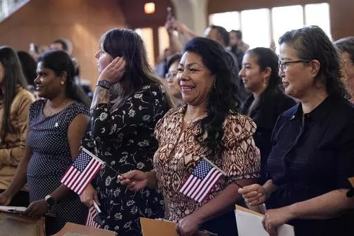 Women representing more than 20 countries take part in a Naturalization Ceremony, March 8, 2024, in San Antonio. More than half of the foreign-born population in the United States lives in just four states — California, Texas, Florida and New York — and their numbers grew older and more educated over the past dozen years, according to a new report released Tuesday, April 9, 2024, by the U.S. Census Bureau. (AP Photo/Eric Gay, File)