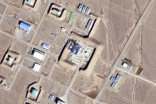 This satellite photo from Planet Labs PBC shows a damaged large building at the Revolutionary Guard's Shahroud Space Center in Semnan province, Iran, Tuesday Oct. 29, 2024. Israel's attack on Iran likely damaged a base run by the paramilitary Revolutionary Guard that builds ballistic missiles and launches rockets as part of its own space program, satellite images analyzed by The Associated Press on Tuesday showed. (Planet Labs PBC via AP)