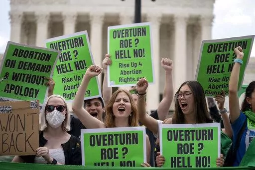 Abortion-rights protesters regroup and protest following Supreme Court's decision to overturn Roe v. Wade in Washington, Friday, June 24, 2022.  Voters in a handful of states will weigh in on abortion in this year’s election in the aftermath of the Supreme Court’s ruling that overturned Roe v. Wade and left abortion rights to the states.  (AP Photo/Gemunu Amarasinghe)