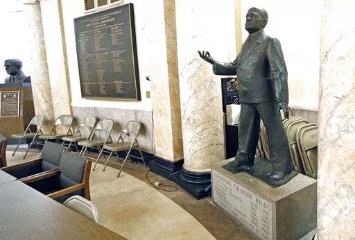 A statue of the late Gov. Theodore Gilmore Bilbo stands out from the back of a first floor conference room at the Capitol Jan. 22, 2009 in Jackson, Miss. A statue of white supremacist former Mississippi Gov. Theodore Bilbo was quietly moved out of sight in the state Capitol in recent months — a move praised by Black lawmakers who say a politician who built a career on racist rhetoric never deserved a place of prominence.(AP Photo/Rogelio V. Solis, File)
